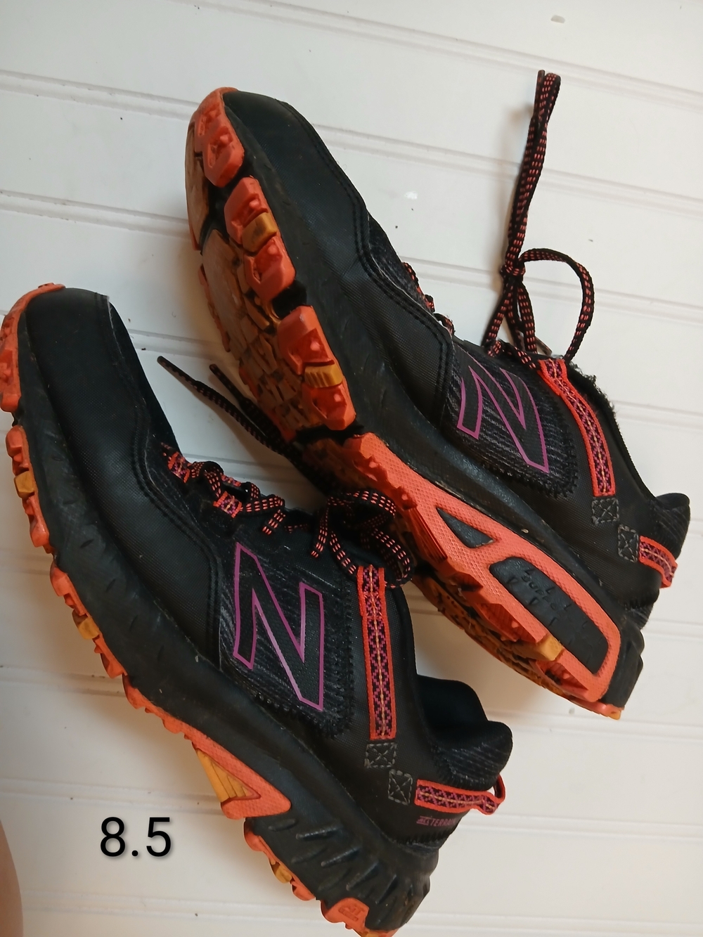 New Balance Women's Black Trail Running Shoes with Orange and Pink Accents